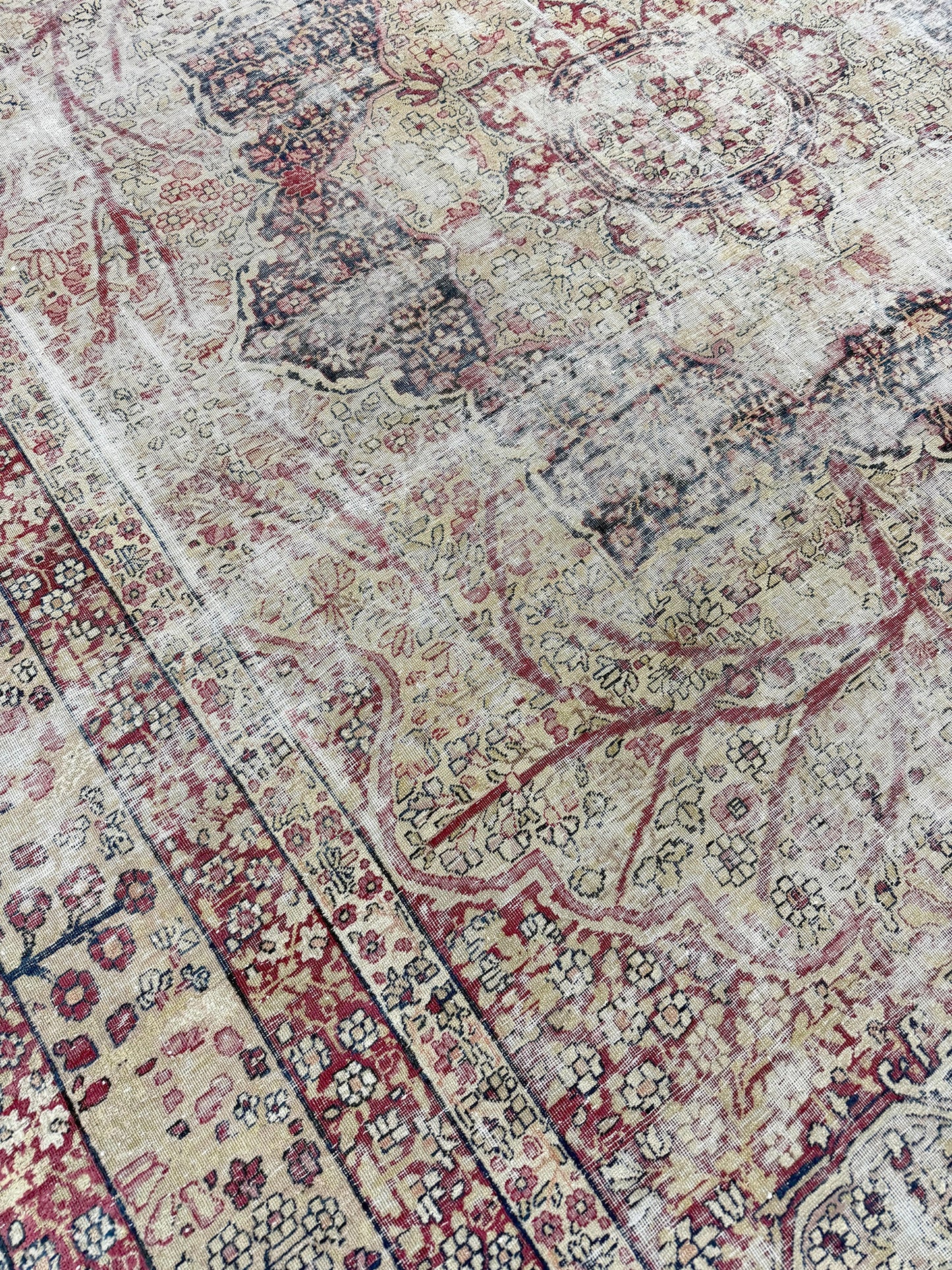 Antique Persian Lavar Kerman Rug - styled in room setting